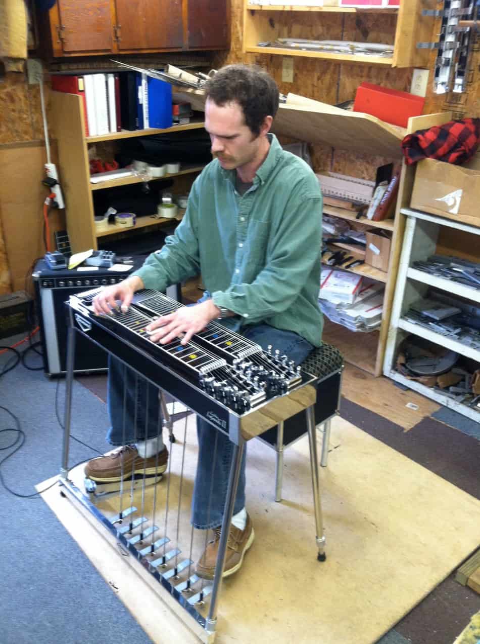 Playing a Black Emmons LeGrande II pedal steel guitar at Billy Knowles' shop