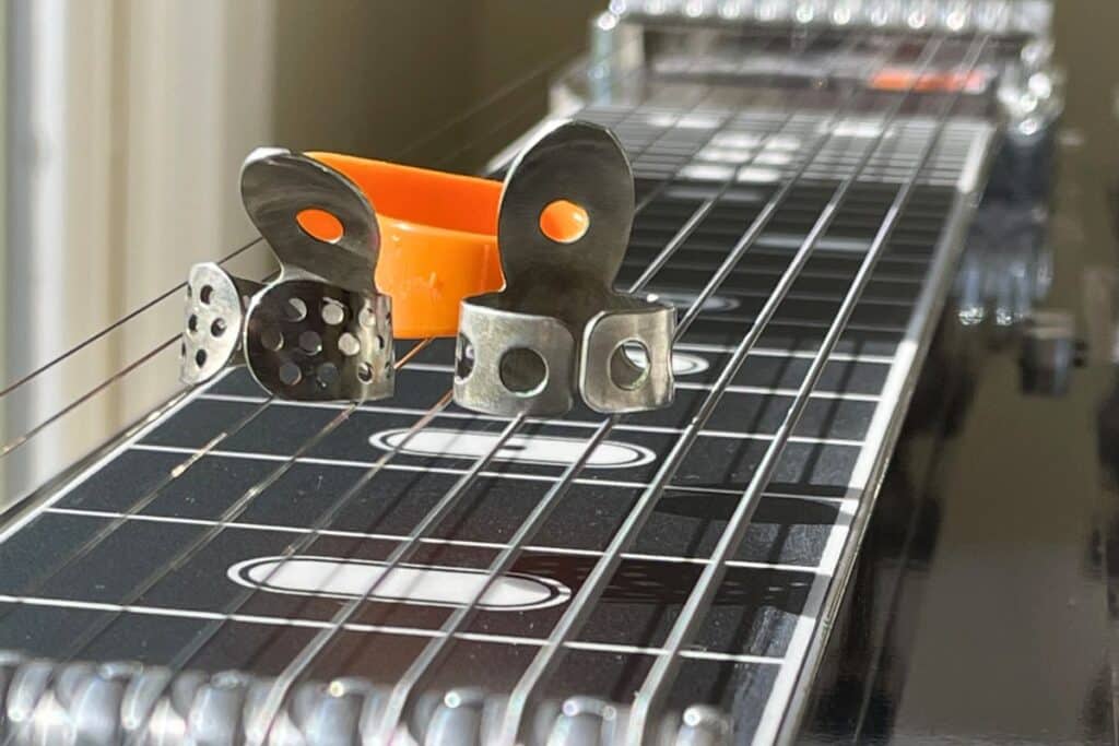 different types of finger and thumb picks for pedal steel guitar
