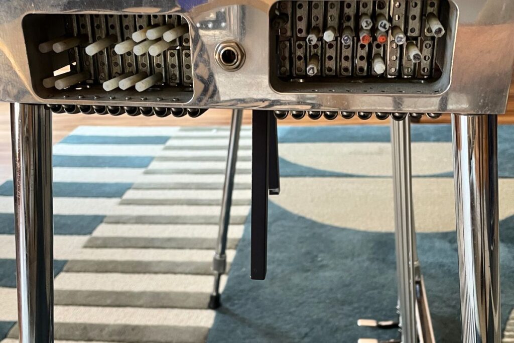 side view of knee levers on pedal steel guitar