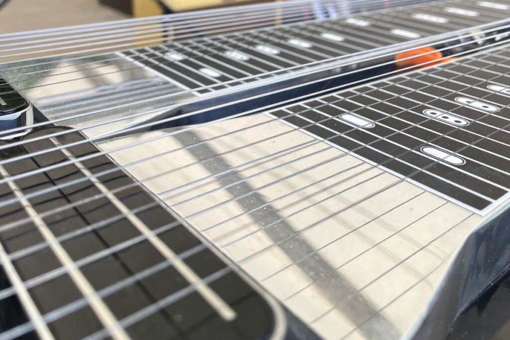 pedal steel strings blocking closeup by pickup